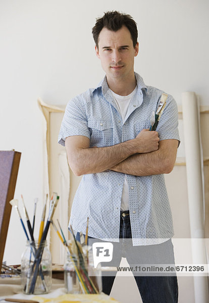 Male artist in painting studio