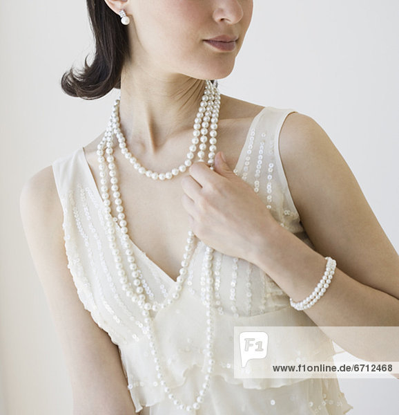 Woman wearing pearl jewelry