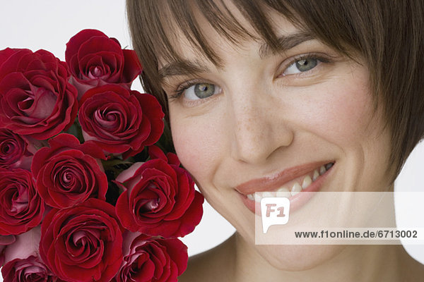Close up of woman next to flowers