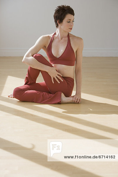 Woman stretching on floor