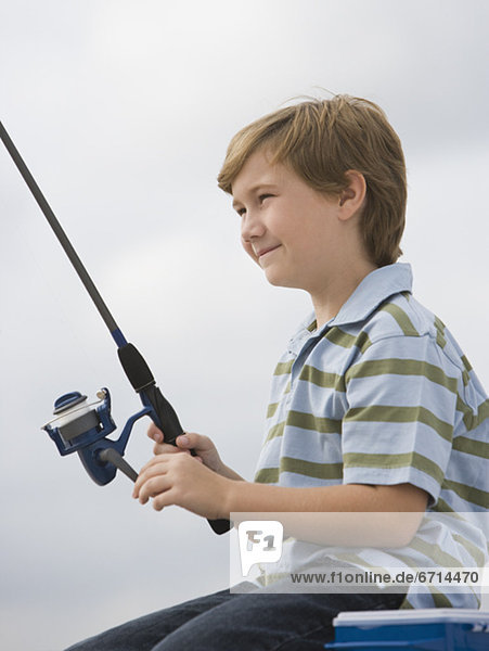 Close up of boy fishing