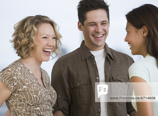 Multi-ethnic friends laughing