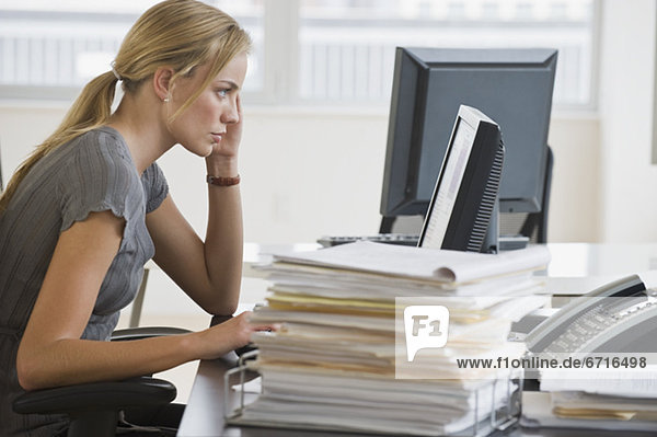 Businesswoman looking at computer