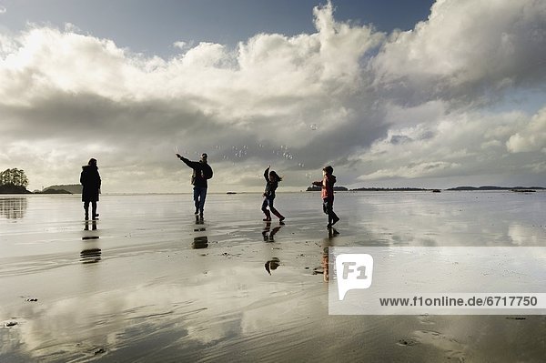 Silhouettes Of People On Beach  Tofino  Vancouver Island  British Columbia  Canada