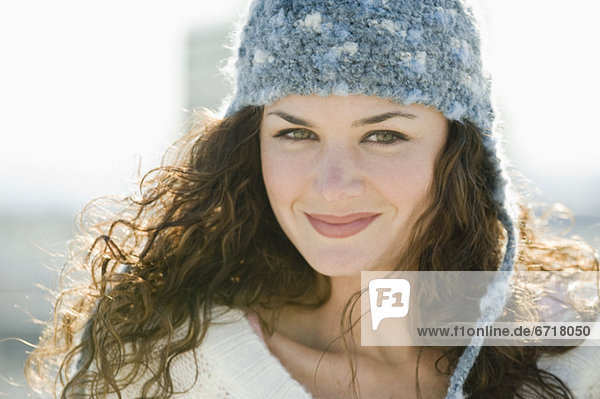 Portrait of smiling woman in stocking cap