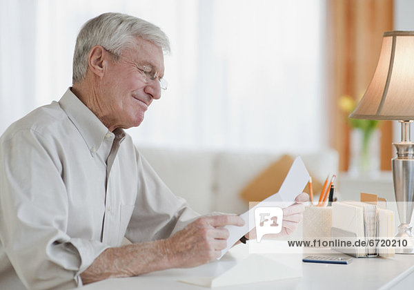 Senior man reading letter