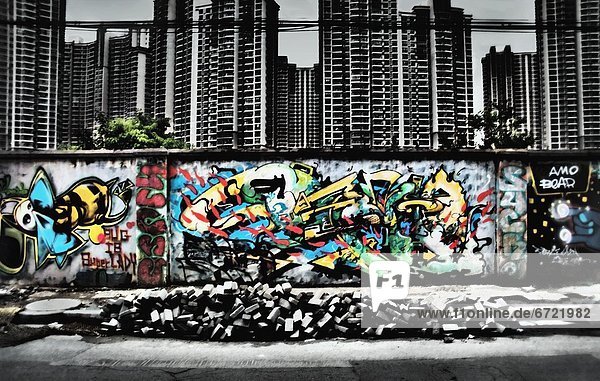A Wall Of Graffiti Below Highrises
