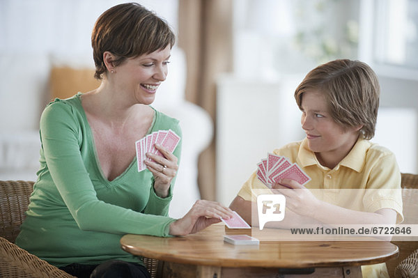 Mother and son playing cards
