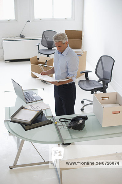 Businessman working in new office
