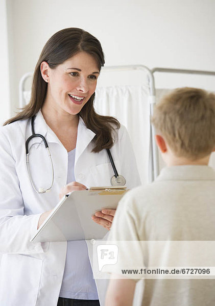 Young boy and doctor in examination room