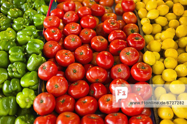 Display of peppers tomatoes and lemons