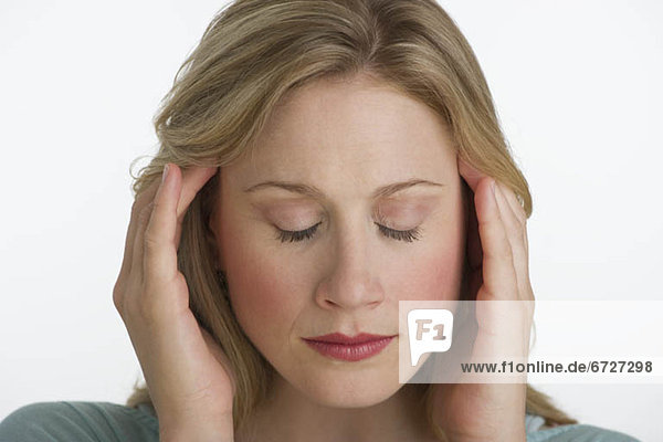 Blond woman with a headache