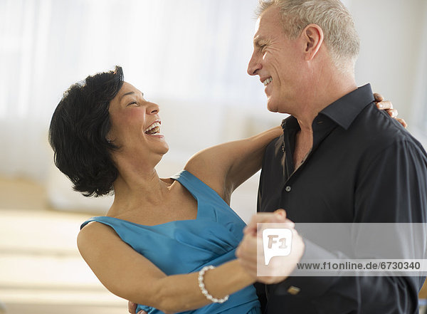 Happy mature couple dancing