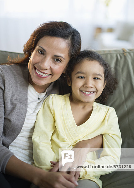 USA  New Jersey  Jersey City  portrait of smiling mother embracing daughter (6-7)