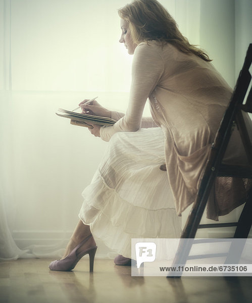 Woman writing journal