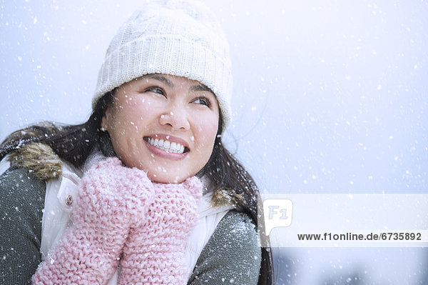 Portrait of happy woman wearing warm clothing