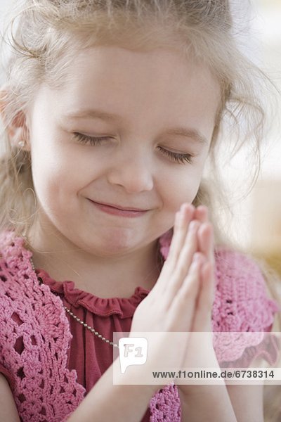 Close up of girl praying