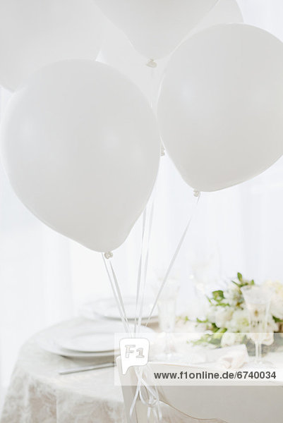 Balloons at wedding table setting  studio shot