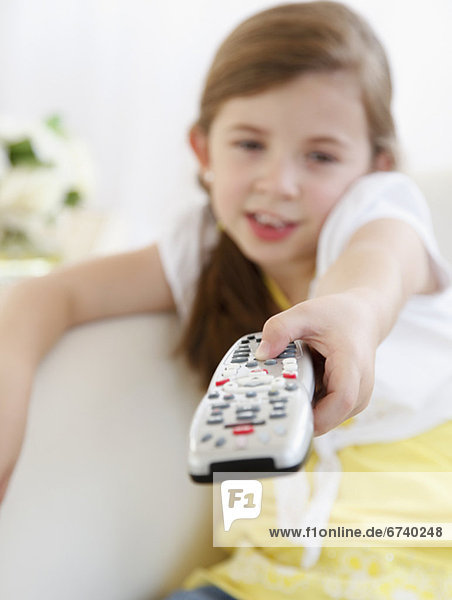 Child with TV remote