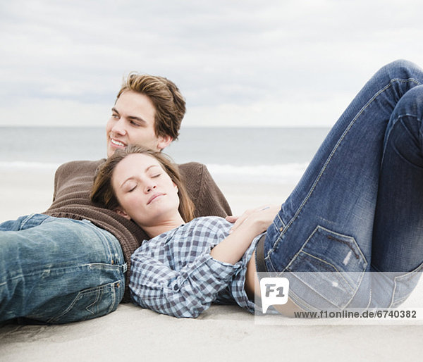 Couple resting on beach