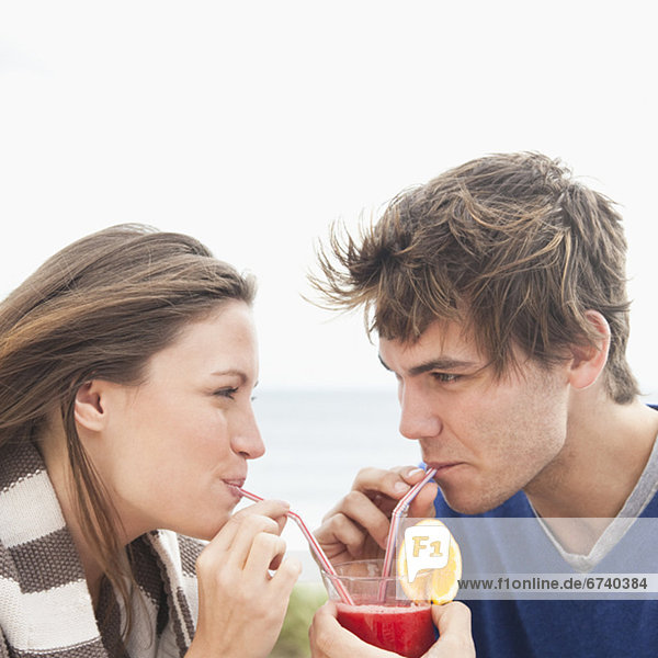Couple sharing drink