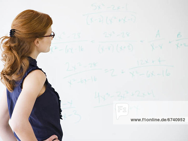 Woman doing math equations