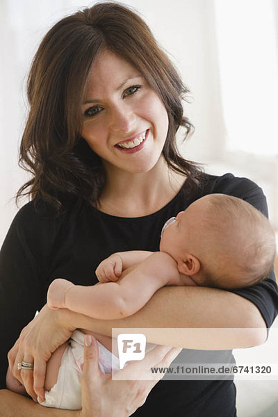 USA  New Jersey  Jersey City  Portrait of mother with baby daughter (2-5 months)