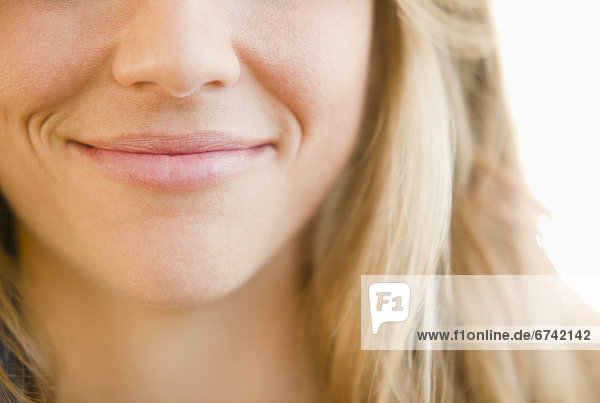 Close up of mouth of smirking woman