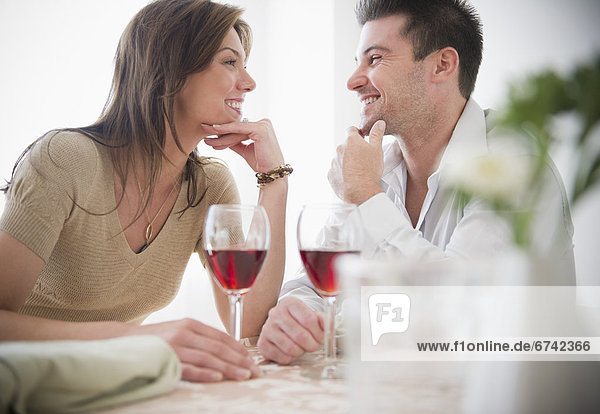 Smiling couple drinking wine