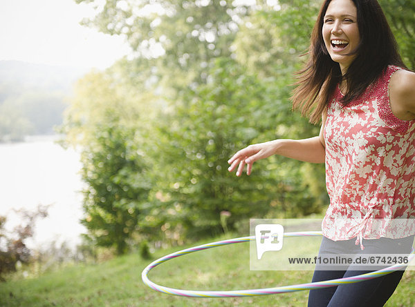Roaring Brook Lake  Woman plying with hoopla hoop