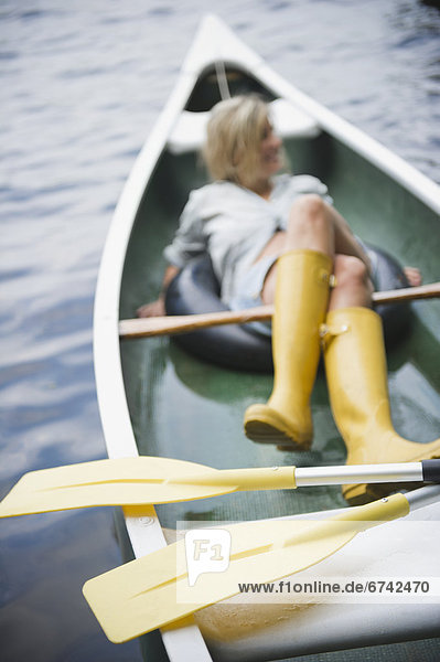Roaring Brook Lake  Woman sitting in boat