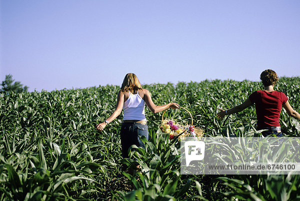 Girls Walking in Corn Field