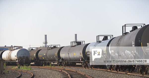 Row of oil tankers in train track