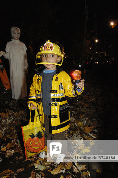 Young Boy in Fire-Fighter Costume on Halloween  Toronto  Ontario