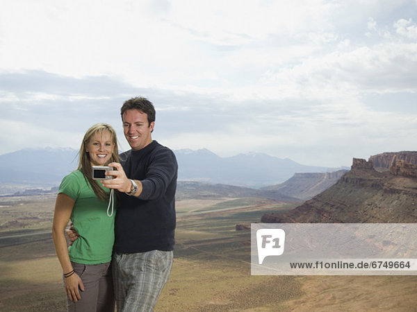 Couple taking own photograph