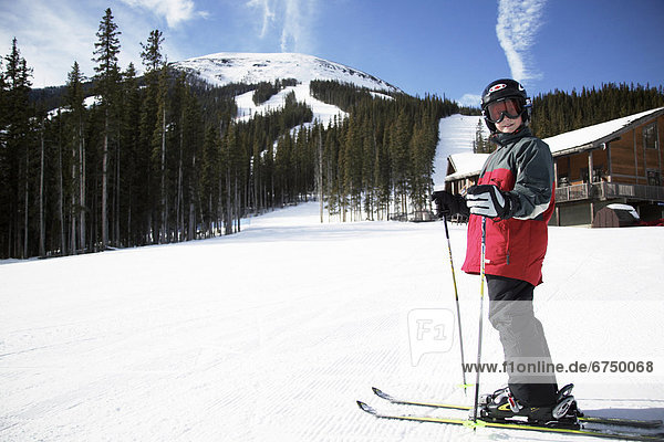 Boy Skier Standing by Lodge  Alberta Rocky Mountains  Canada