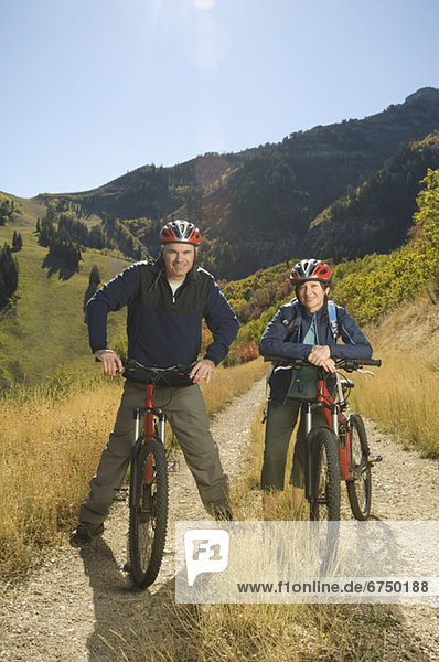 Senior couple on mountain bikes  Utah  United States