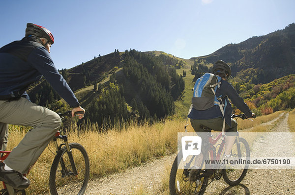 Senior couple riding mountain bikes  Utah  United States