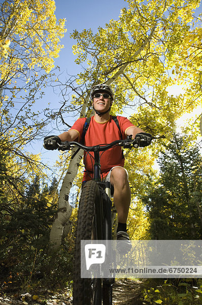 Man riding mountain bike  Utah  United States