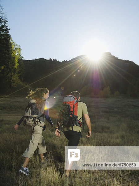 Couple hiking with backpacks  Utah  United States