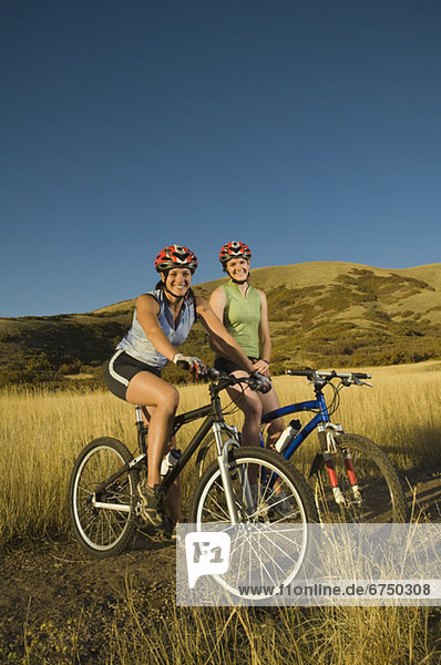 Two women on mountain bikes  Salt Flats  Utah  United States