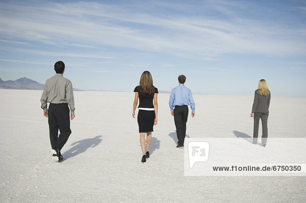 Businesspeople walking on salt flats  Salt Flats  Utah  United States