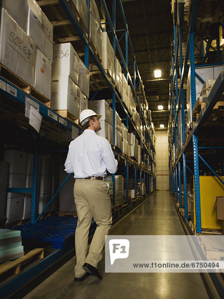 Warehouse worker checking inventory
