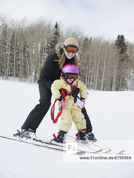 Mother and child skiing