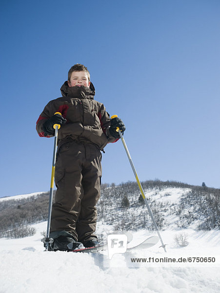 Boy standing on skis