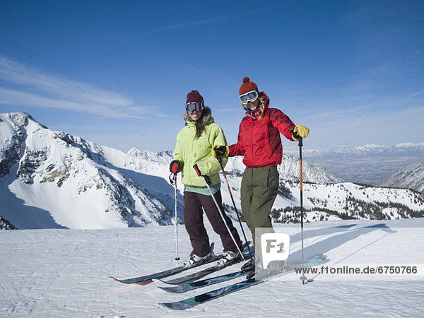 Women standing on skis  Wasatch Mountains  Utah  United States