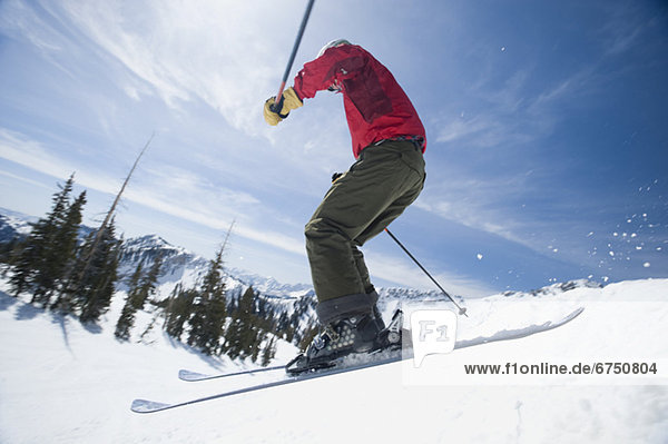 Woman on skis in air