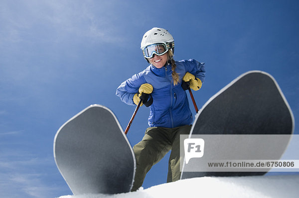 Low angle view of woman on skis