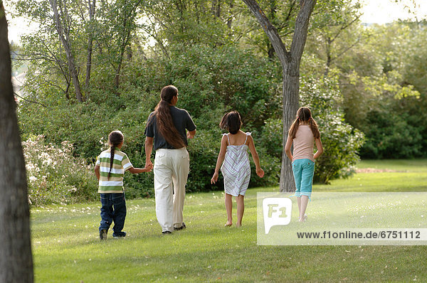 Family Walking in Park