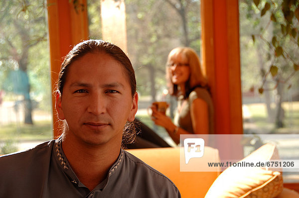 Close-up of Man Woman in Background